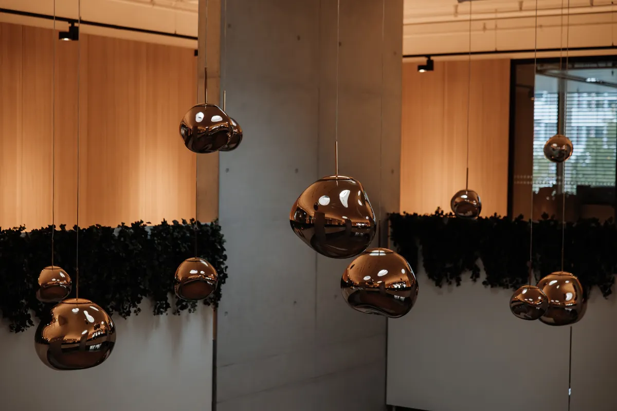 Contemporary sculptural pendant lights in a warm interior